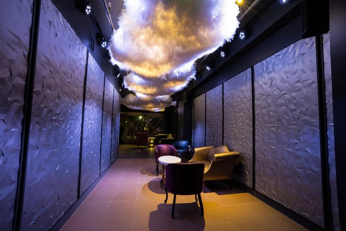 A dark Saint Yves room with a cloud ceiling